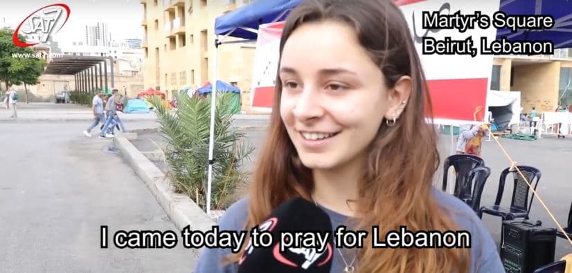 Young Woman Prays for Lebanon