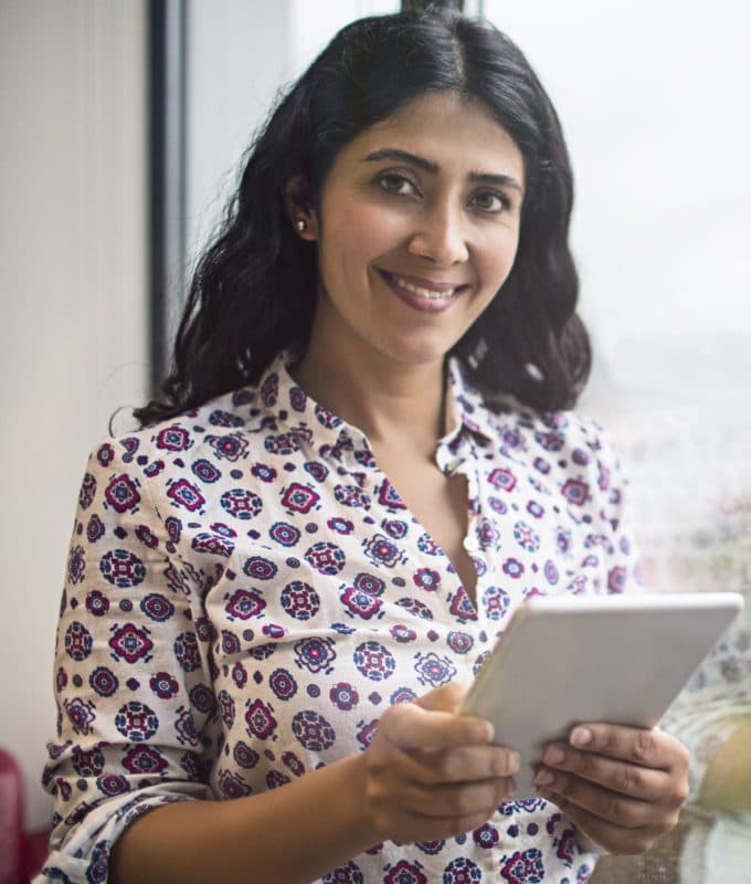 Businesswoman portrait in the office next to the window