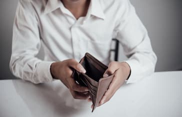 businessman saving money,Man carrying a wallet in hand, the dollar,finance accounting concept