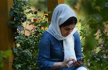 Afghan lady in a garden_thump